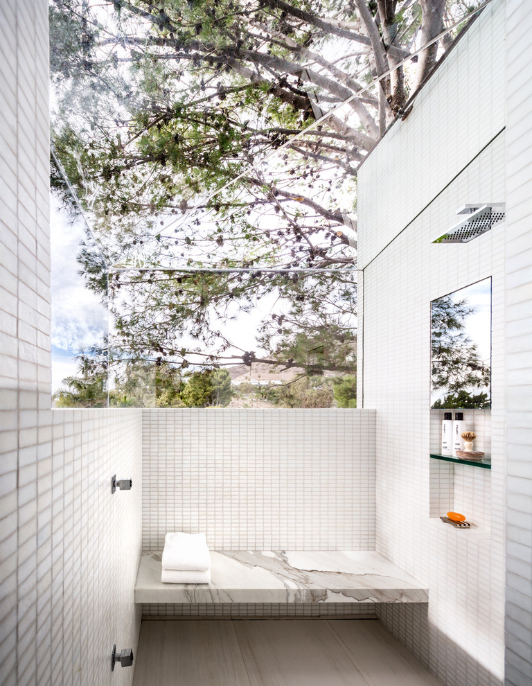 Expansive midcentury master bathroom in Los Angeles with an open shower, white tile, mosaic tile, white walls, ceramic floors, a niche and a shower seat.