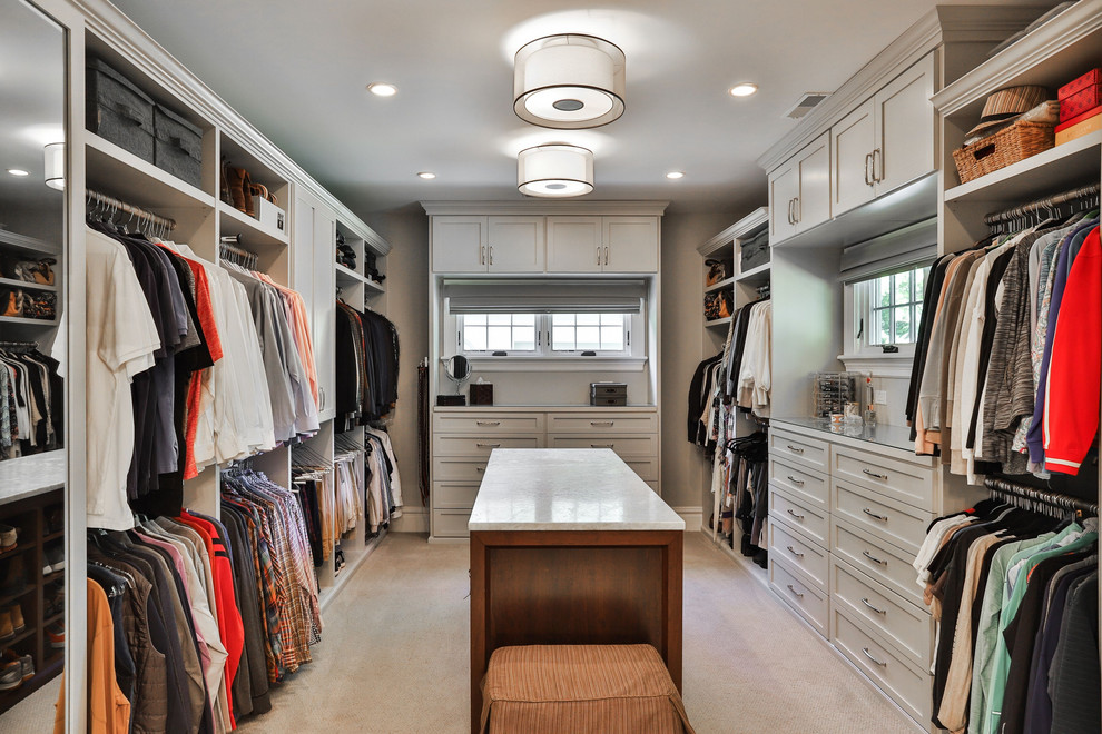 Design ideas for a transitional gender-neutral dressing room in St Louis with shaker cabinets, grey cabinets, carpet and beige floor.