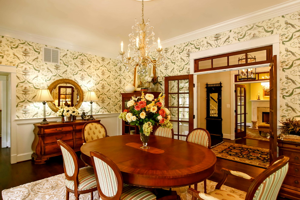 Photo of a traditional separate dining room in DC Metro with multi-coloured walls and dark hardwood floors.