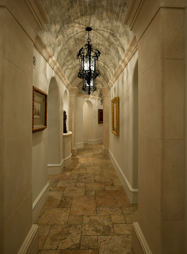 Inspiration for a large transitional hallway in Phoenix with beige walls, travertine floors and beige floor.