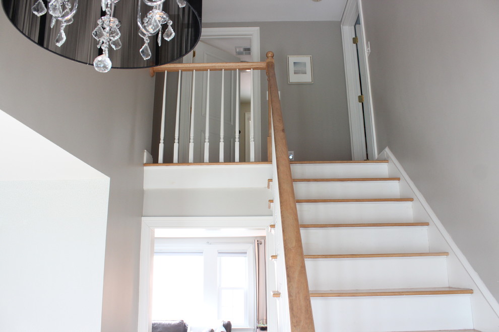 Mid-sized transitional light wood floor foyer photo in Boston with gray walls