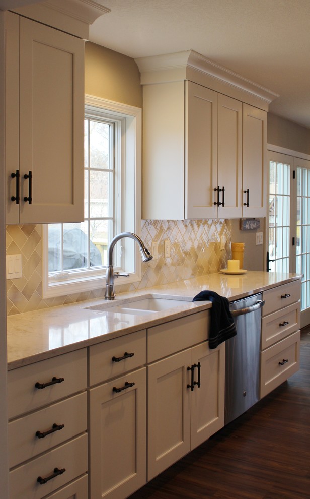 Inspiration for a transitional kitchen remodel with recessed-panel cabinets, white cabinets, quartz countertops and an island
