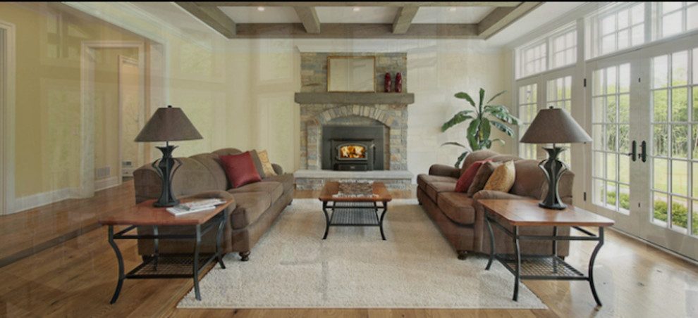 Design ideas for a mid-sized country formal enclosed living room in Denver with a standard fireplace, no tv, yellow walls, light hardwood floors and a stone fireplace surround.