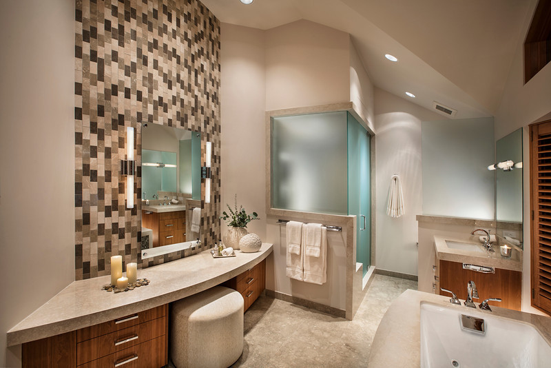 This is an example of a large contemporary master bathroom in Denver with flat-panel cabinets, medium wood cabinets, a drop-in tub, a corner shower, a two-piece toilet, black and white tile, stone tile, beige walls, an undermount sink, marble benchtops, beige floor and a hinged shower door.