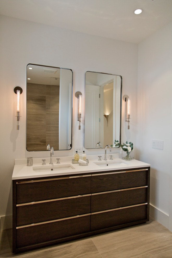 This is an example of a mid-sized beach style master bathroom in Miami with furniture-like cabinets, black cabinets, an alcove shower, white walls, ceramic floors, an undermount sink, marble benchtops, grey floor, a hinged shower door, white benchtops, a double vanity and a built-in vanity.