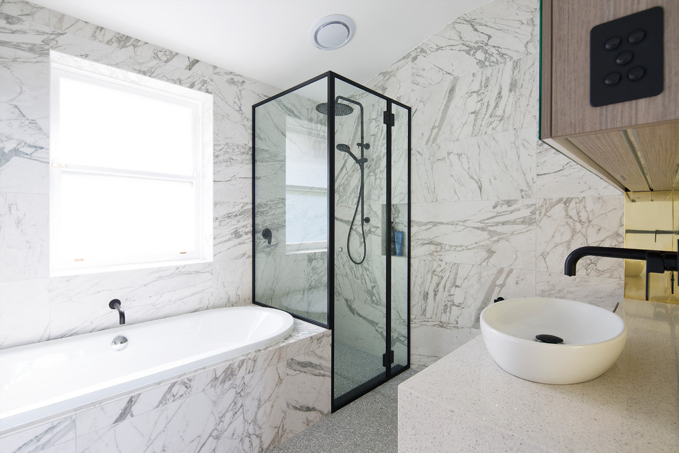 Inspiration for a contemporary master bathroom in Sydney with medium wood cabinets, a drop-in tub, a curbless shower, a vessel sink, grey floor, a hinged shower door and white benchtops.