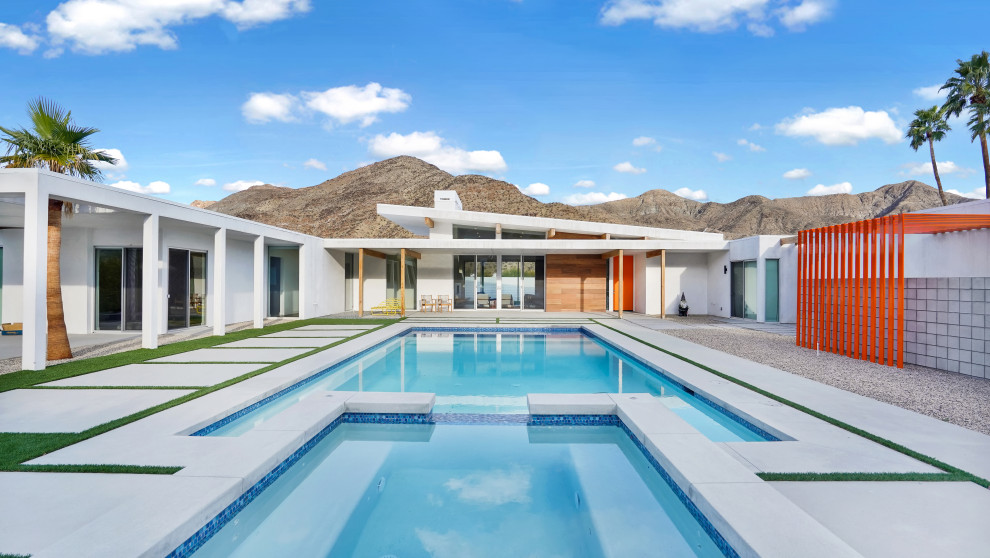 This is an example of a midcentury pool in Other.