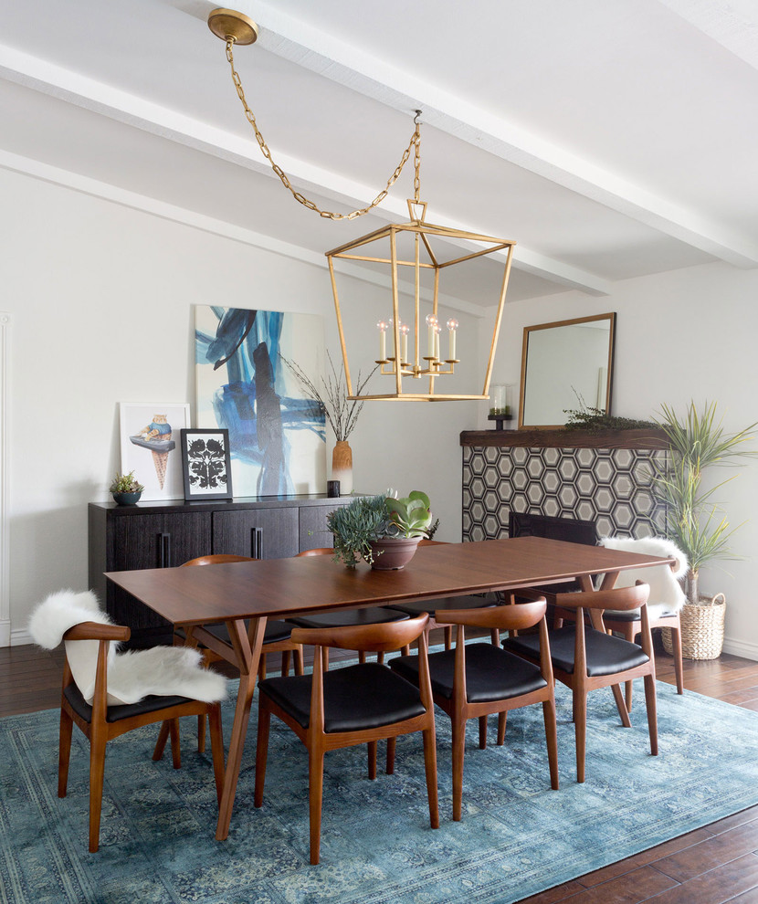 Kitchen/dining room combo - mid-sized contemporary dark wood floor kitchen/dining room combo idea in Los Angeles with white walls, a standard fireplace and a tile fireplace