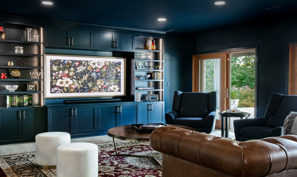 Inspiration for a large transitional basement in St Louis with a home bar, blue walls, medium hardwood floors and brown floor.