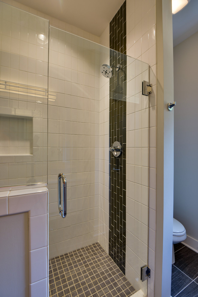 Photo of a small modern master bathroom in Nashville with a vessel sink, flat-panel cabinets, light wood cabinets, quartzite benchtops, an open shower, a two-piece toilet, white tile, ceramic tile, grey walls and porcelain floors.