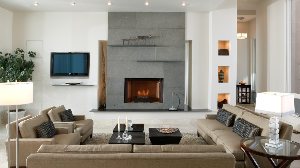 This is an example of a mid-sized modern formal enclosed living room in Sacramento with white walls, travertine floors, a standard fireplace, a concrete fireplace surround, a built-in media wall and beige floor.