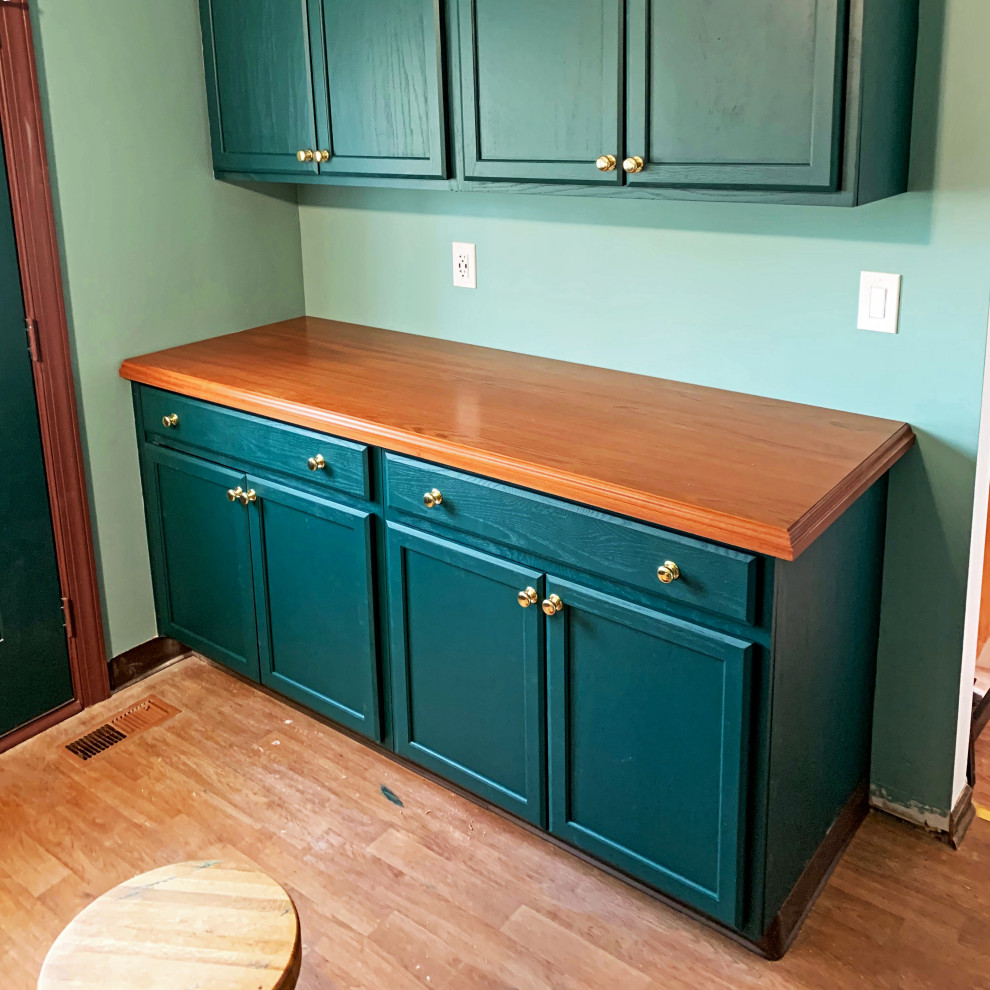 Inspiration for a mid-sized timeless u-shaped medium tone wood floor and brown floor enclosed kitchen remodel in Other with recessed-panel cabinets, green cabinets, wood countertops, green backsplash, an island and red countertops
