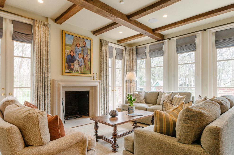 Inspiration for a traditional living room in Nashville with beige walls and a standard fireplace.
