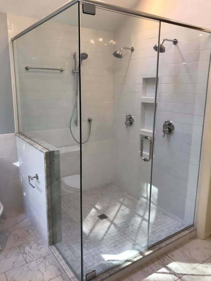 Photo of a mid-sized country master wet room bathroom in Raleigh with shaker cabinets, white cabinets, a one-piece toilet, white tile, ceramic tile, blue walls, marble floors, a drop-in sink, marble benchtops, white floor, a hinged shower door, grey benchtops, a double vanity, a built-in vanity and vaulted.