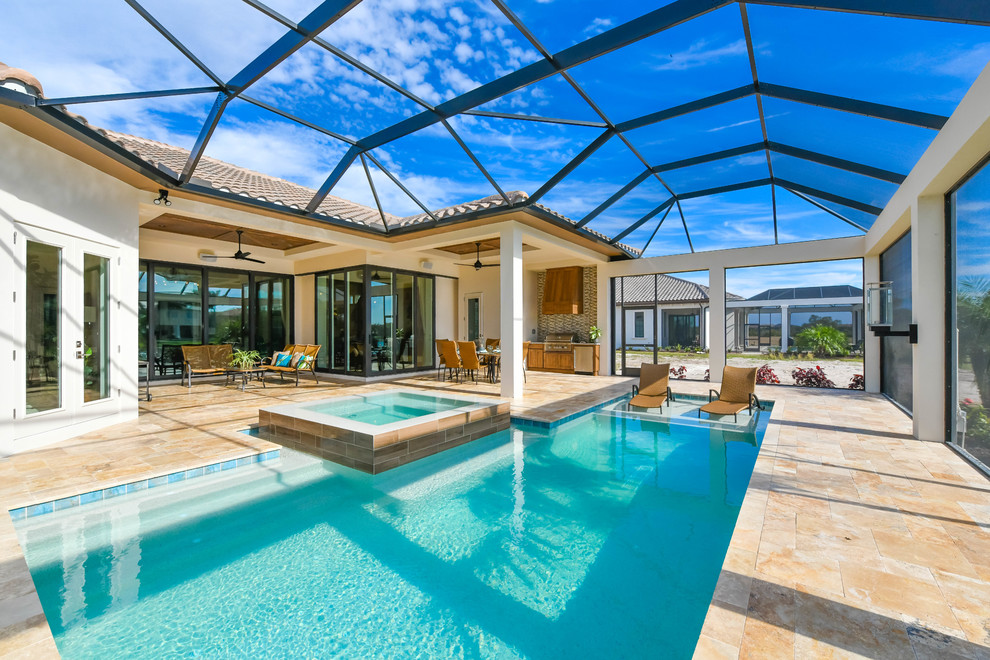 Transitional indoor rectangular pool in Miami with a hot tub.