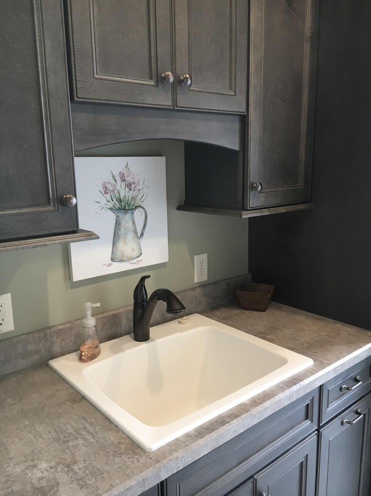 Design ideas for a large country utility room in Other with a drop-in sink, recessed-panel cabinets, grey cabinets, laminate benchtops, grey walls, porcelain floors, a side-by-side washer and dryer and beige floor.