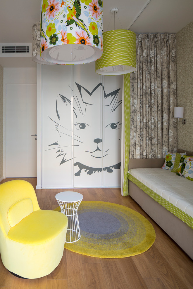 Contemporary kids' bedroom in Moscow with medium hardwood floors and multi-coloured walls for girls.