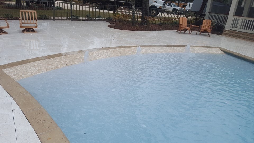 Inspiration for a mid-sized transitional backyard concrete paver and rectangular infinity pool fountain remodel in Miami