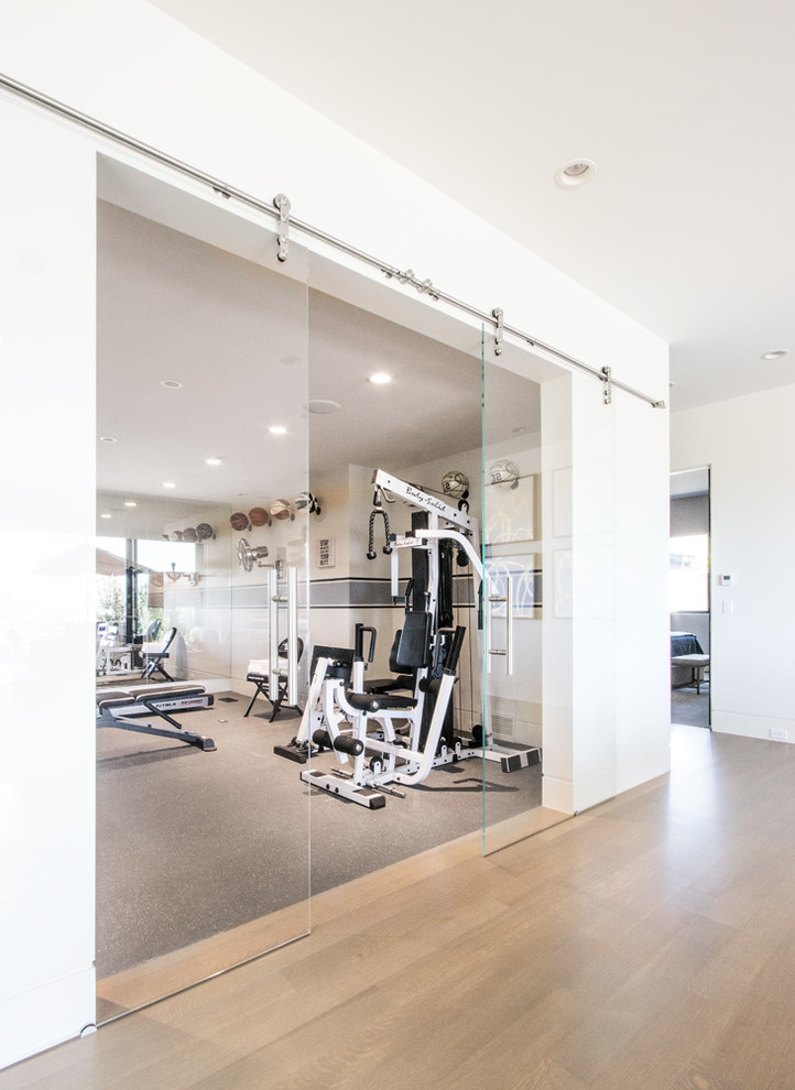 Design ideas for a mid-sized contemporary home weight room in Salt Lake City with white walls, linoleum floors and grey floor.