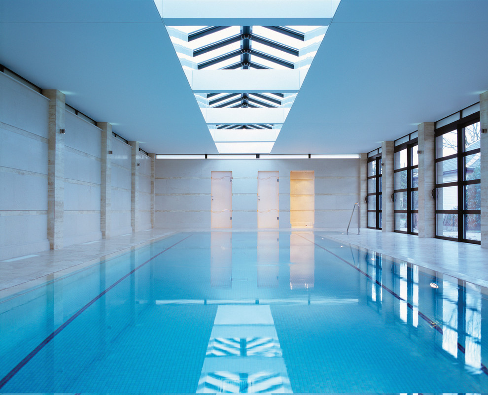 Photo of a contemporary indoor rectangular pool in London.