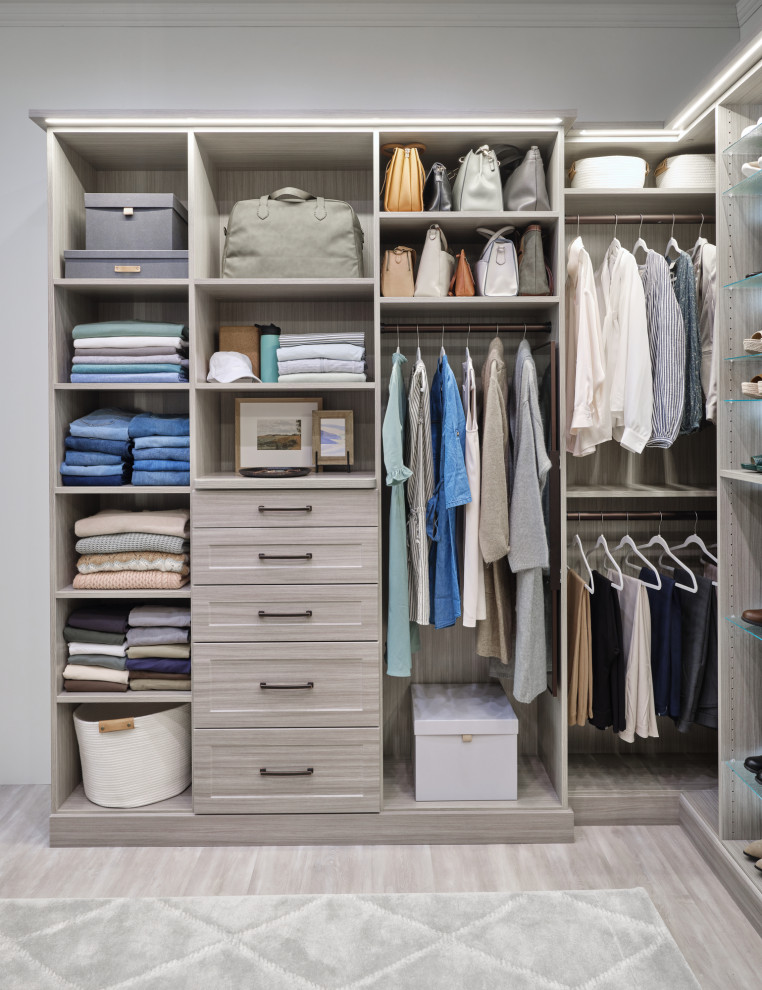 Design ideas for a large contemporary built-in wardrobe in Burlington with white cabinets.