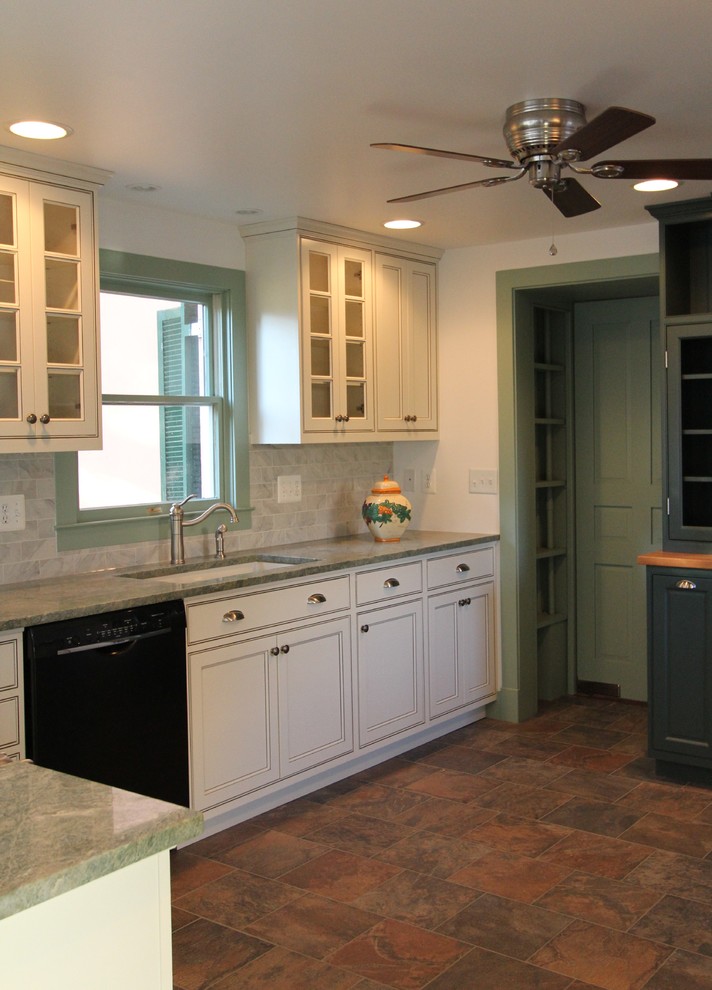 Photo of a large country l-shaped eat-in kitchen in Baltimore with a double-bowl sink, beaded inset cabinets, white cabinets, granite benchtops, white splashback, subway tile splashback, black appliances, slate floors and no island.
