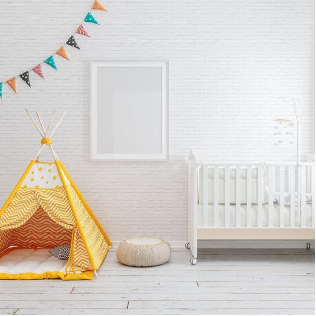 На фото: детская в стиле модернизм с белыми стенами и кирпичными стенами для ребенка от 1 до 3 лет
