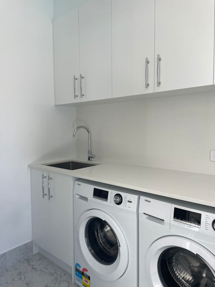 Design ideas for a transitional laundry room in Sydney.