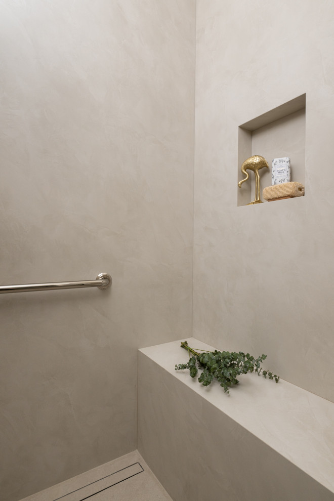 Example of a transitional master porcelain tile, beige floor, double-sink and wainscoting freestanding bathtub design in Orange County with shaker cabinets, medium tone wood cabinets, white walls, a drop-in sink, quartzite countertops, multicolored countertops and a built-in vanity