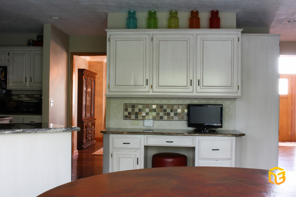 Kitchen - transitional medium tone wood floor kitchen idea in Omaha with distressed cabinets and an island