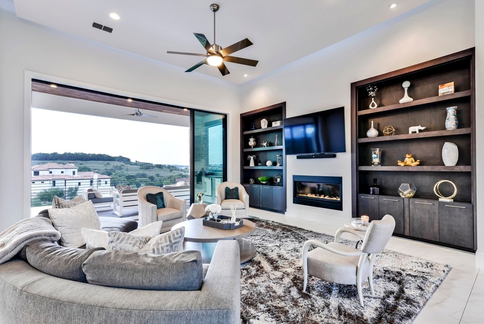 This is an example of a large contemporary open concept living room in Austin with a library, white walls, ceramic floors, a wall-mounted tv, white floor, a ribbon fireplace and a metal fireplace surround.