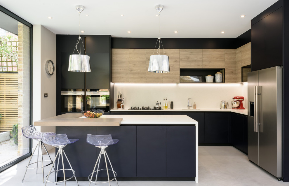 Design ideas for a medium sized contemporary kitchen in London with black cabinets and an island.