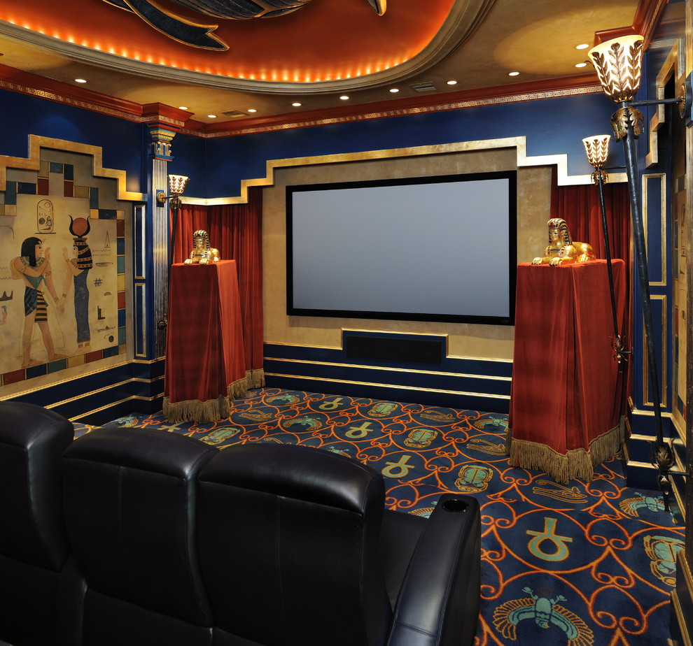 This is an example of a large eclectic open concept home theatre in Houston with multi-coloured walls, carpet and a projector screen.