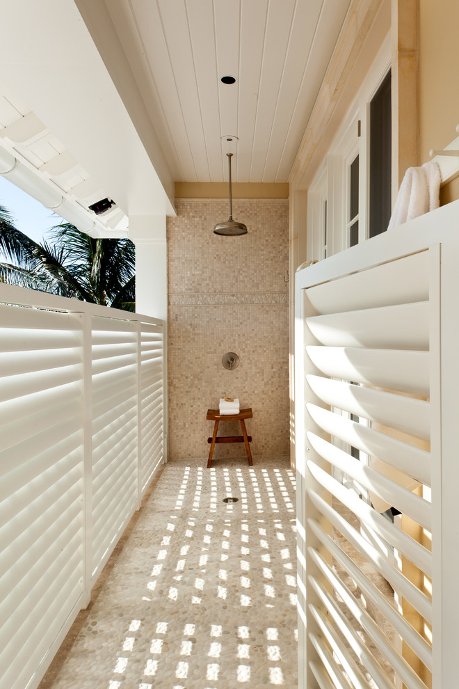 This is an example of a traditional patio in Miami with an outdoor shower.