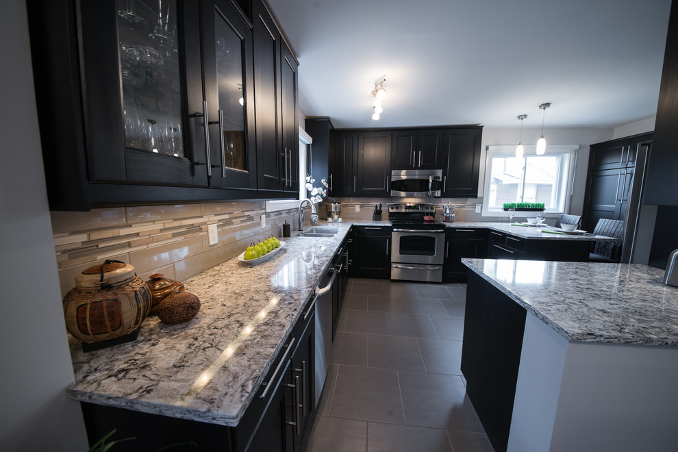 Example of a transitional porcelain tile eat-in kitchen design in Ottawa with an undermount sink, recessed-panel cabinets, quartz countertops, glass tile backsplash and stainless steel appliances