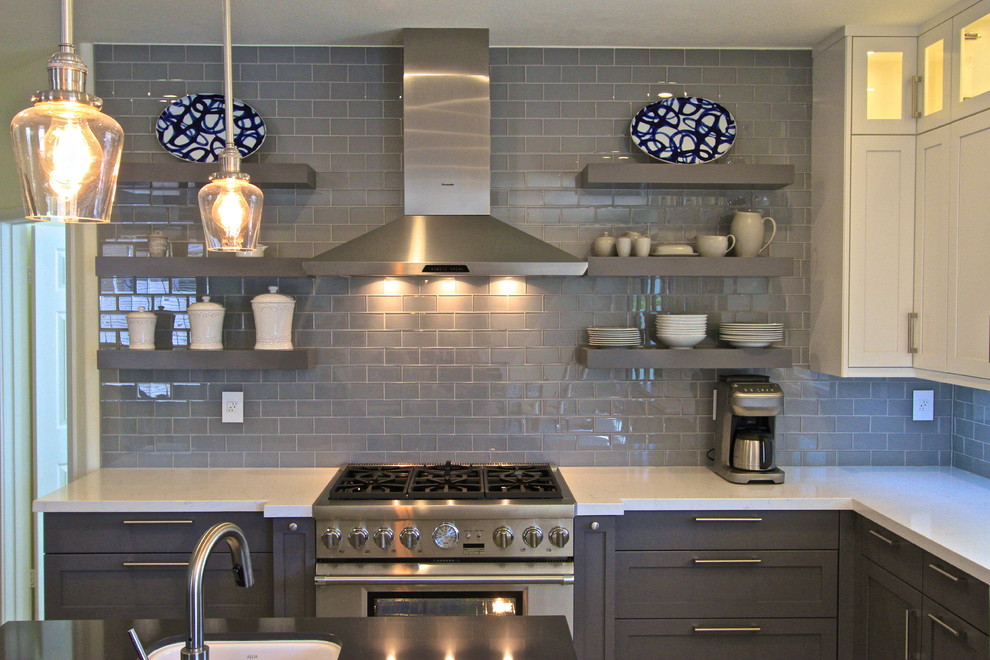 Transitional porcelain tile kitchen photo in Orange County with glass tile backsplash and an island