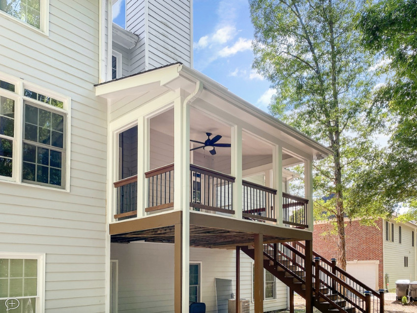 Deck - large contemporary backyard second story wood railing deck idea in Atlanta with a roof extension