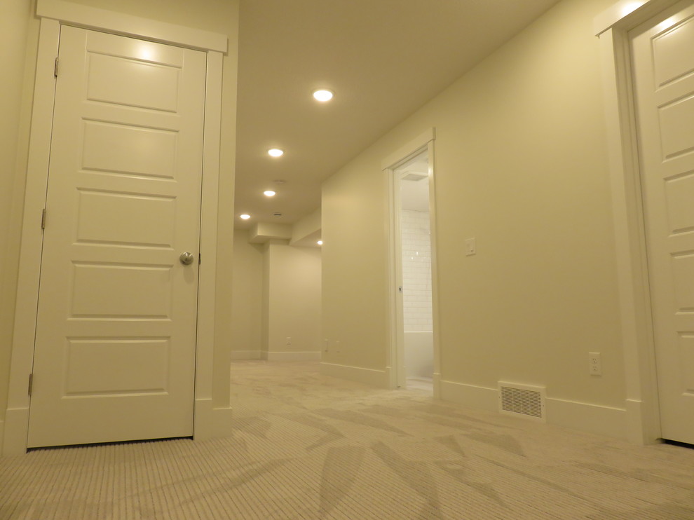 Example of a mid-sized transitional home design design in Calgary