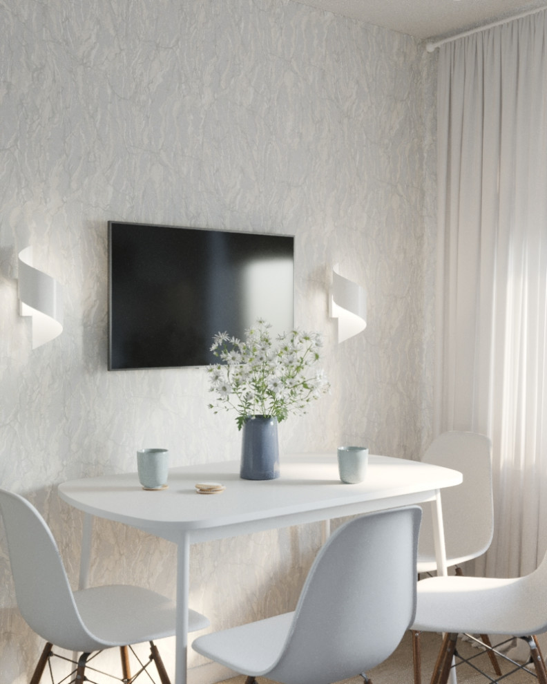 Маленькая кухня с ярким фартуком.