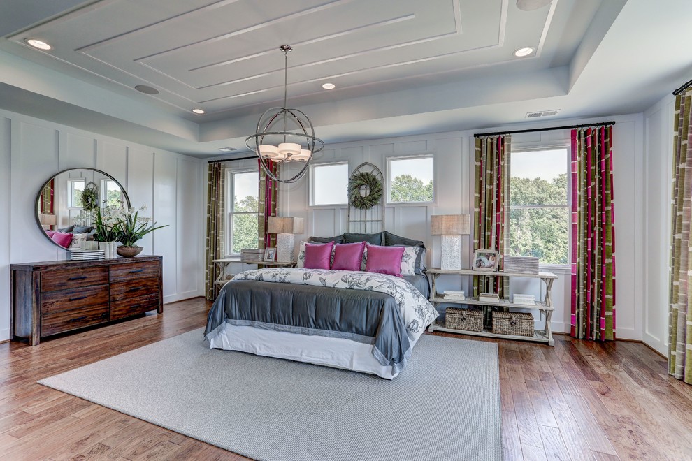Transitional bedroom in DC Metro with white walls and dark hardwood floors.