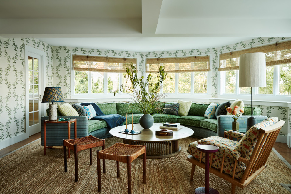 Rockport Summer House - A vintage Milo Baughman sectional, reupholstered in a playful two-tone mix, anchors the turreted living room and frames sweeping ocean views. We embraced the room's quirky angles with a climbing patterned wallpaper.