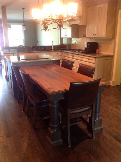 Example of a kitchen design with wood countertops