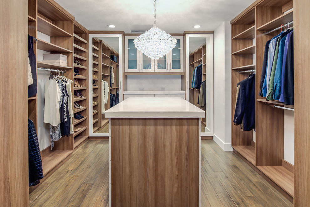 Design ideas for a large modern gender-neutral walk-in wardrobe in Phoenix with open cabinets, medium wood cabinets, dark hardwood floors and brown floor.