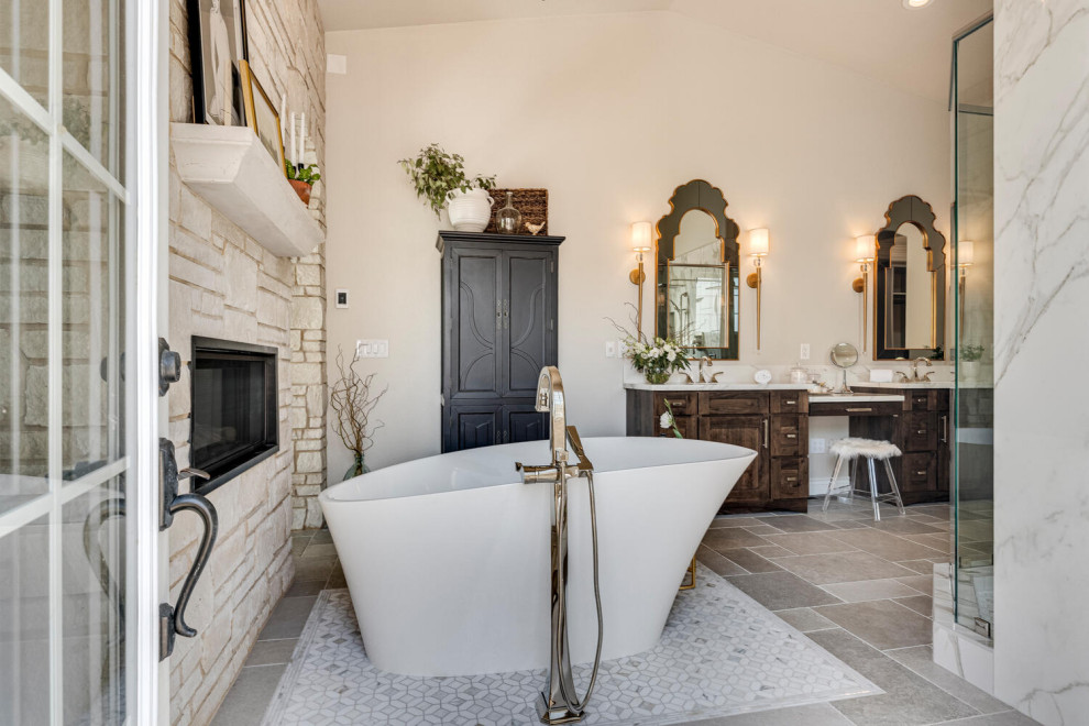 Design ideas for a large mediterranean master bathroom in Other with shaker cabinets, dark wood cabinets, a freestanding tub, a double shower, an undermount sink, grey floor, a hinged shower door, white benchtops, a shower seat, a double vanity, a built-in vanity and vaulted.