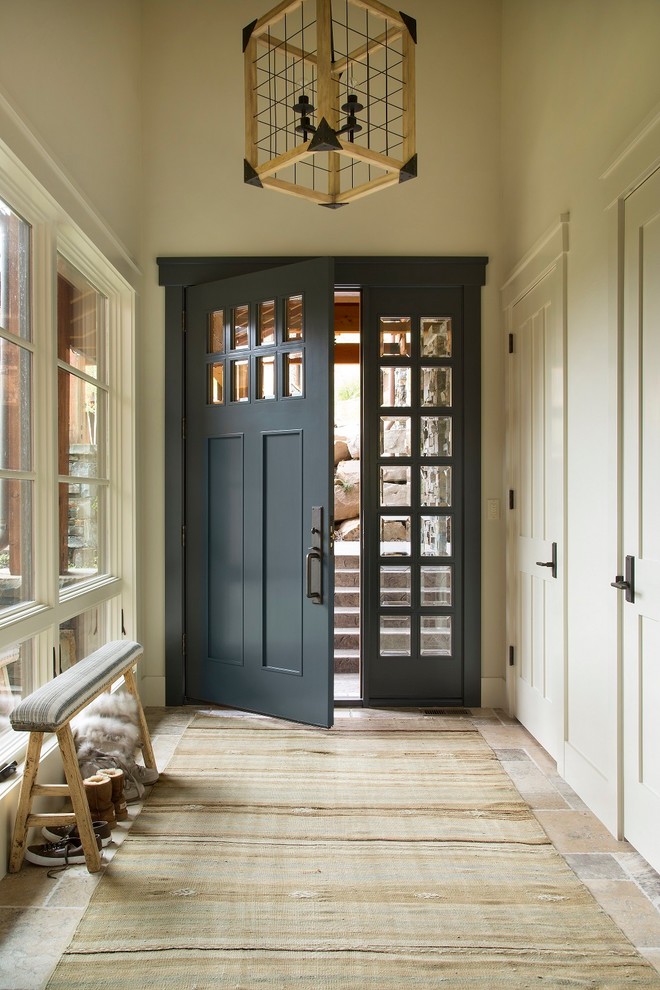 Photo of a country entry hall in Seattle with beige walls, a single front door and a gray front door.