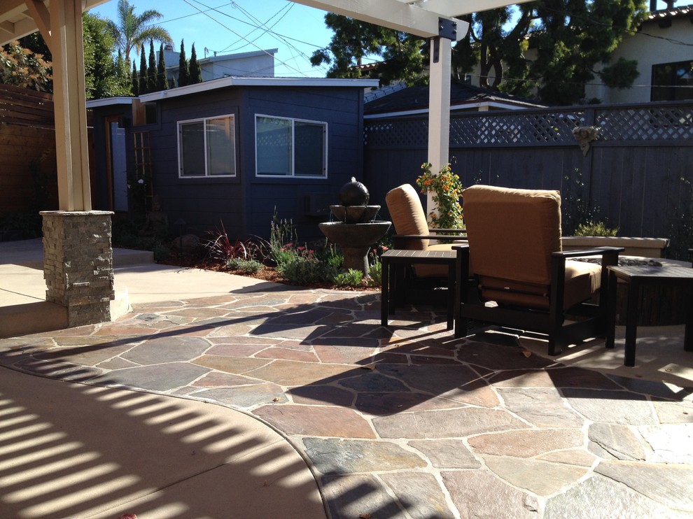 Mid-sized traditional backyard patio in San Diego with a fire feature, concrete slab and a gazebo/cabana.