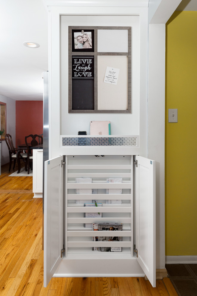 Inspiration for a mid-sized transitional u-shaped medium tone wood floor and beige floor eat-in kitchen remodel with a farmhouse sink, shaker cabinets, gray cabinets, marble countertops, multicolored backsplash, stone tile backsplash, stainless steel appliances, a peninsula and black countertops