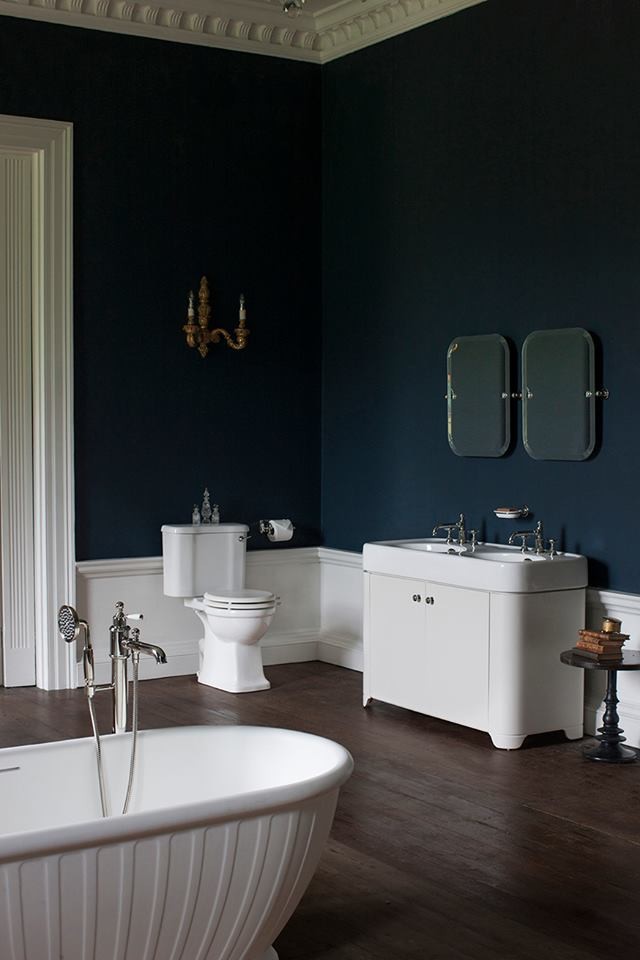 This is an example of a mid-sized traditional kids bathroom in Cambridgeshire with shaker cabinets, grey cabinets, a freestanding tub, a curbless shower, a one-piece toilet, gray tile, porcelain tile, grey walls, porcelain floors, a pedestal sink and marble benchtops.