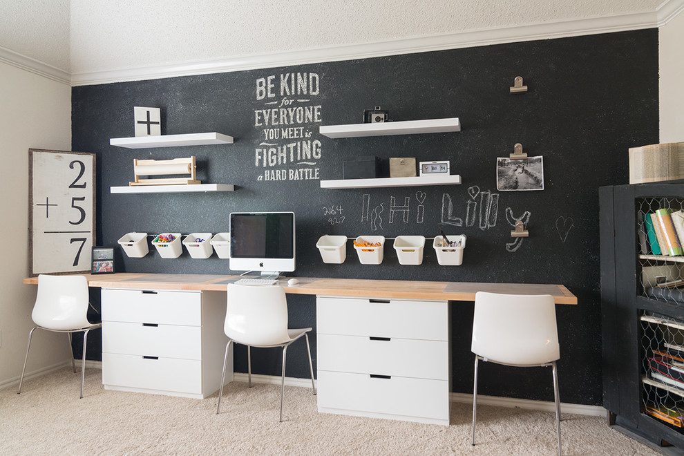 Scandinavian Office - Modern Office that doubles as a craft room with chalkboard wall, floating shelves and storage bins.