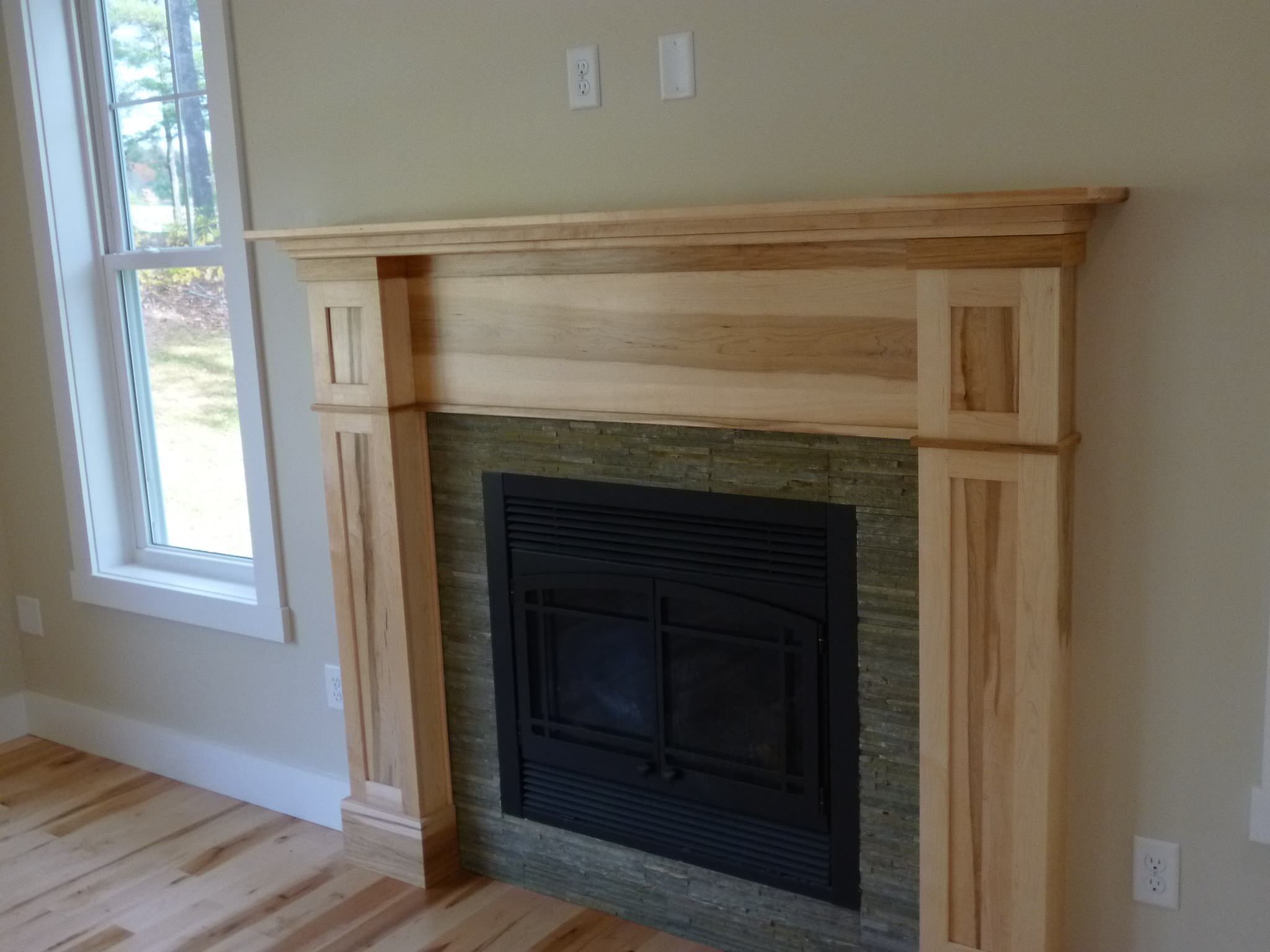 Kahn fireplace surround. Shaker style in brown maple.
